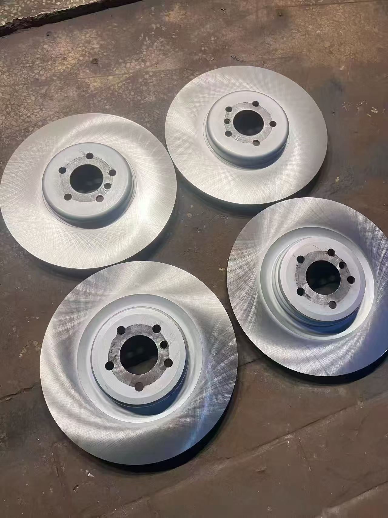 A batch of four freshly machined rotors