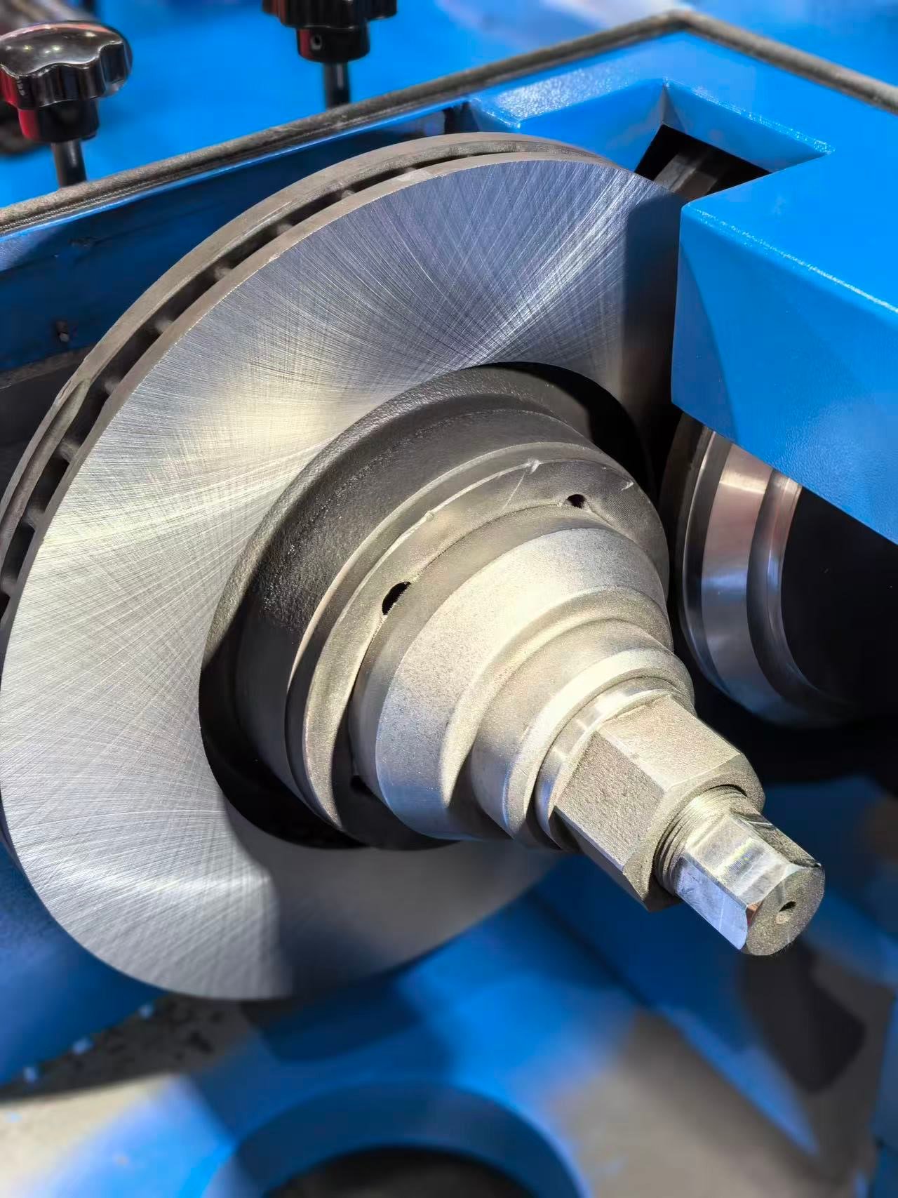 A rotor being machined on the brake lathe